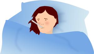 girl in bed with thermometer in mouth