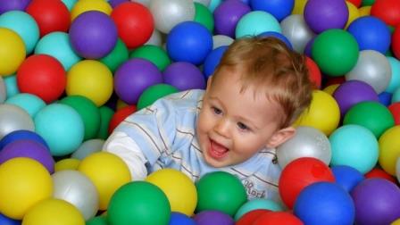 Todler playing in ball pit